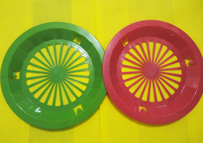 red and green plastic bilao holder with white paper plate